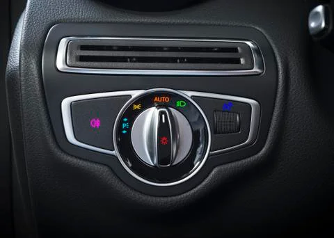Detail of the headlight button in a car. Stock Photos