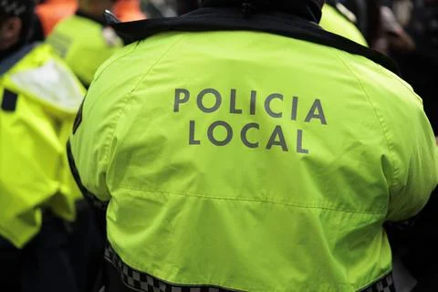 Detail of High-Visibility Jacket With the Text Local Police Fotos de archivo