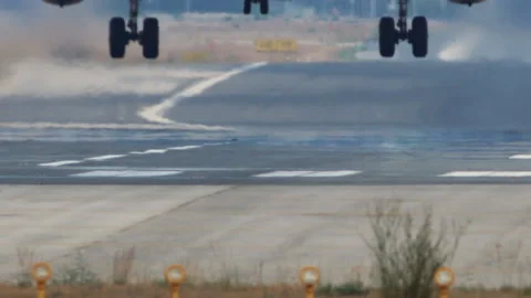 Detail of jet plane landing gear on runway Stock Footage 94767734