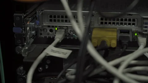 Detail of lights blinking cloud computing system on rack in server room Pan-r Stock Footage 141546696