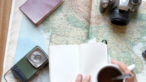 Detail of a man's hands   preparing a trip with a map Stock Footage 127686586