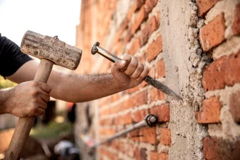 Detail of men working in construction Stock Photos