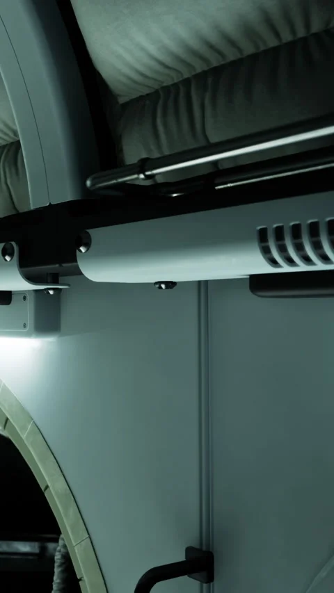 Detail of a modern bed design in a sleeping pod with stylish lighting Video stock 336430859