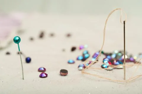 Detail of a needle with thread in the workroom tailor Stock Photos