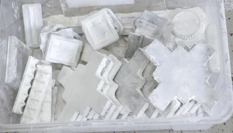 Detail objects printed on a 3D printer and covered with white polyamide powder Stock Photos