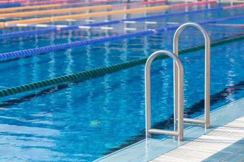 Detail from olympic swimming pool with swim lanes Stock Photos