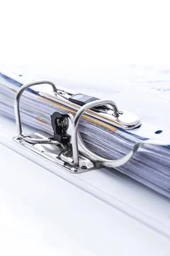 Detail of open folder filled with documents. Symbol of business or bureaucracy Stock Photos