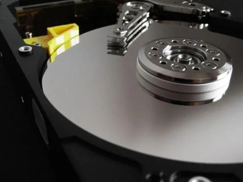 Detail from an opened hard disk Stock Photos