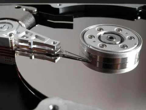 Detail from an opened hard disk Stock Photos