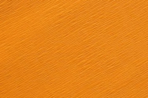 Detail of an orange crepe paper crinkly texture Stock Photos