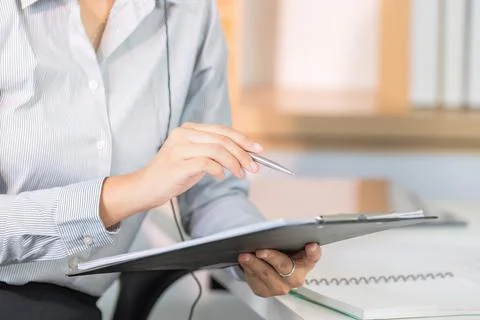 Detail-Oriented Customer Service Agent Reviewing Client Information Stock Photos