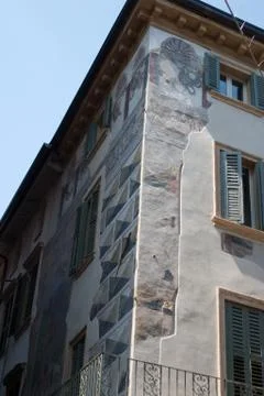 Detail of a painted pattern with 3d effect on an old house in Italy Stock Photos