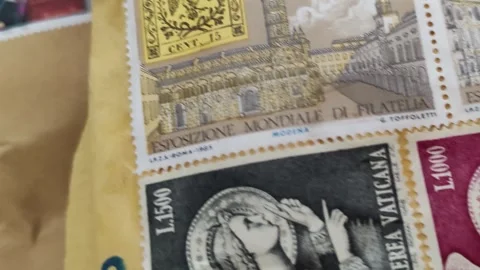 Detail of a pair of postage stamp envelopes Video stock 334628952