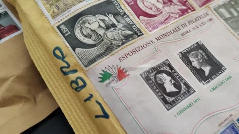 Detail of a pair of postage stamp envelopes Stock Footage 334628974