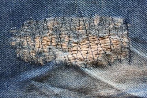 Detail of a patch in blue jeans Stock Photos