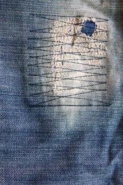Detail of a patch in blue jeans Stock Photos