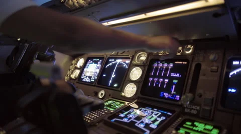 Detail of pilot adjusting instruments in 747 cockpit 4K Stock Footage 53128824