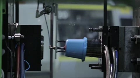 Detail of plastic production in automated press Stock Footage