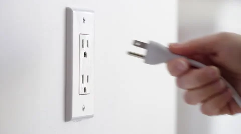 Detail of plugging and unplugging a power cord 4K Stock Footage