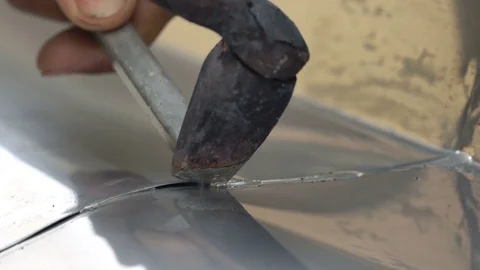 Detail of a roofer welding stainless gutter Stock Footage 73290863