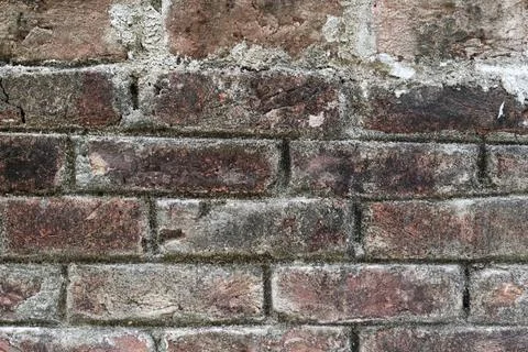 Detail of a Rustic Red Brick Facade with Weathered Grey Mortar Joints Stock Photos