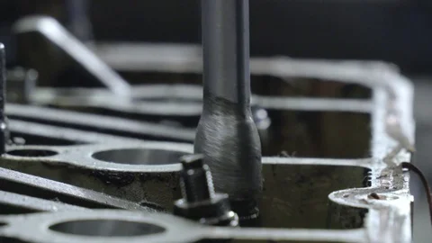 Detail of screwdriver screwing screw on engine Video stock 72934198