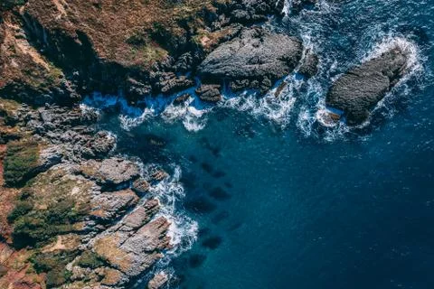 Detail of sea waves colors breaking in the coast of Sonabia, Cantabrian sea Stock Photos