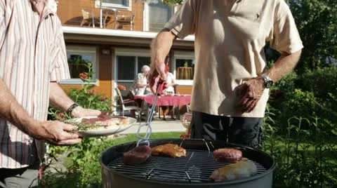 Detail senior men putting meat on grill Stock Footage