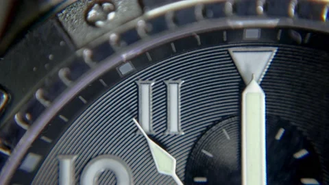 Detail shot of the second hand of a wristwatch approaching twelve o'clock Stock Footage