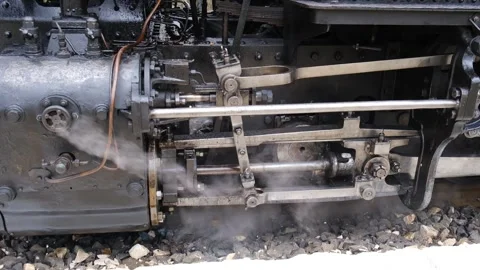 Detail shot of steam train engine with smoke. Black train composition, waiting Stock Footage 243755540