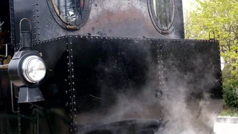 Detail shot of steam train engine with smoke. Black train composition, waiting Stock Footage 243763993