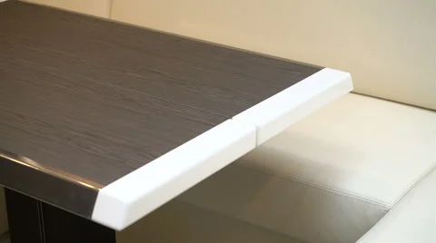 Detail of sofa and table in the salon of a boat Stock Footage 62573456