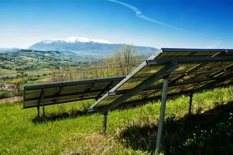 Detail of a solar panel system overlooking the mountains and nature Stock Photos