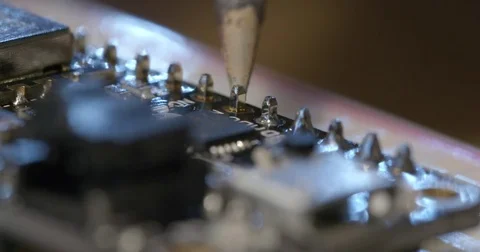 Detail of soldering electronics on small circuit board 4K Video stock 84960924