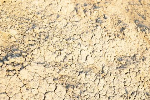 Detail of surface texture with small pebble rock on dirty ground. Stock Photos
