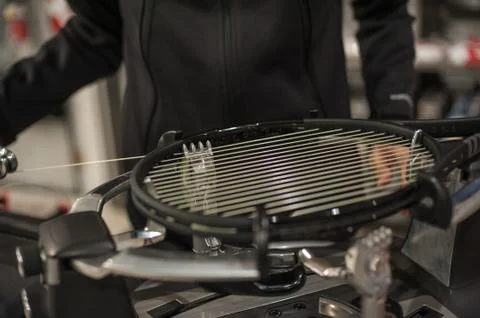 Detail of tennis racket in the stringing machine Stock Photos