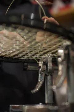 Detail of tennis racket in the stringing machine Stock Photos