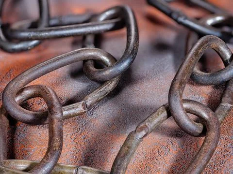 Detail texture of old rusty link chain on a grunge background Stock Photos