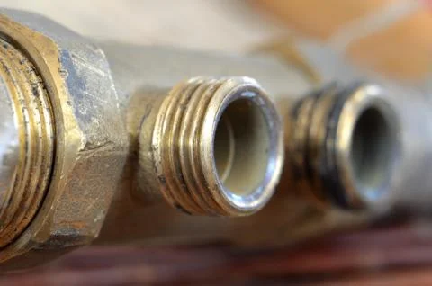 Detail of thread on the pipe with a hose connection Stock Photos