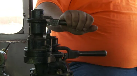 Detail of train driver using brakes and sounding horn HD Stock Footage 39773353