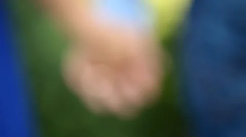 Detail of two lovers joining hands Stock Footage 33828726