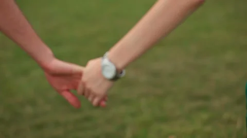 Detail of two lovers joining hands 스톡 동영상 38271563