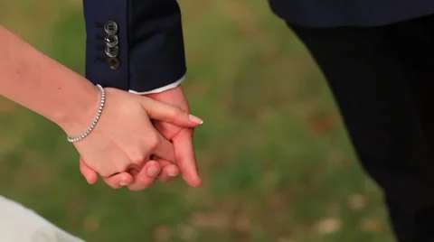 Detail of two lovers joining hands Stock Footage 40831818