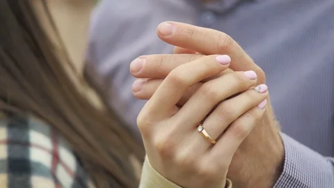 Detail of two lovers joining hands Stock Footage 78370071