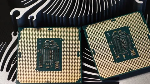 Detail of two modern computer processor on top of aluminum heat sinks Stock Footage 232424479
