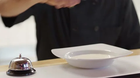 Detail of an unrecognizable chef serving a plate of cream in a restaurant Stock Footage 165182976