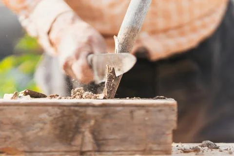 Detail view of man's hands working in the field. Selective focus. Stock Photos