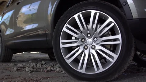Detail view of modern parked car wheel. Video stock 80979061
