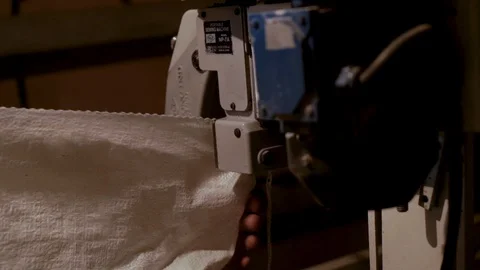 Detail view o process of stitching a bag with wheat grain Stock-Footage 98126408