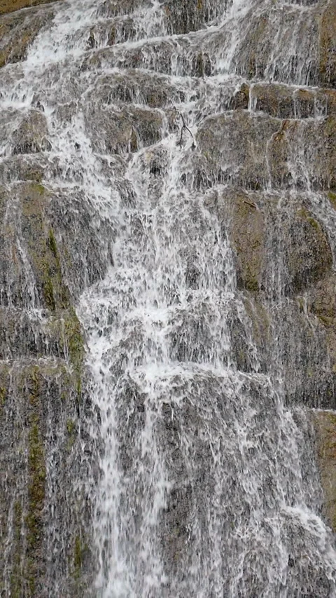 Detail view of waterfall in vertical format. Slow Motion. Vídeos de archivo 288985595